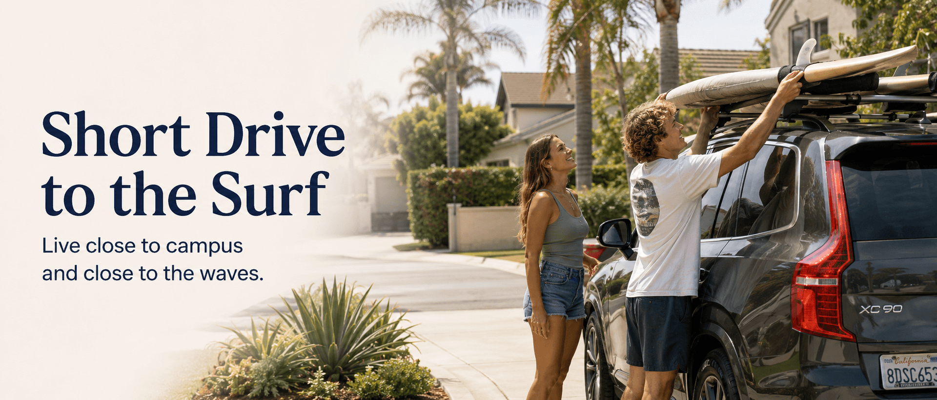 Students loading surfboards onto a car outside a San Diego rental home