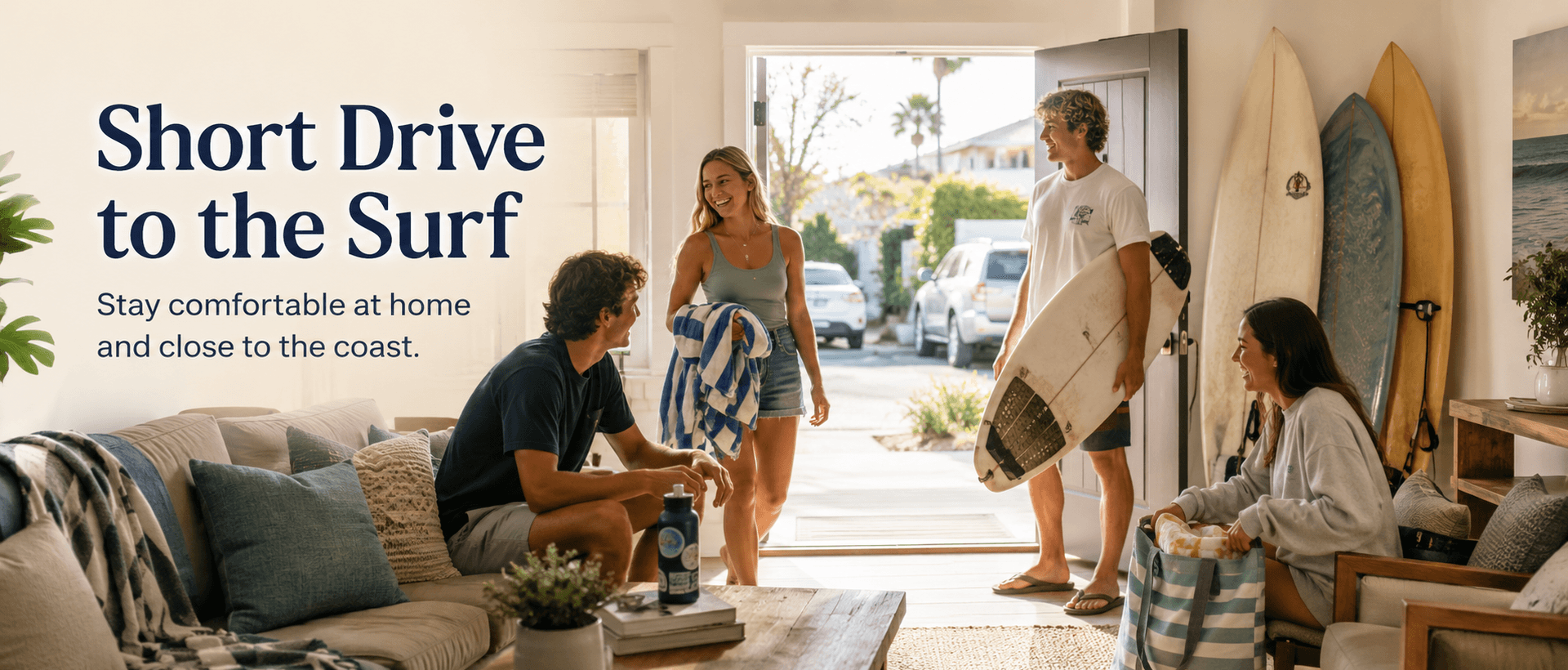 Students returning from surfing into a shared living room near the coast
