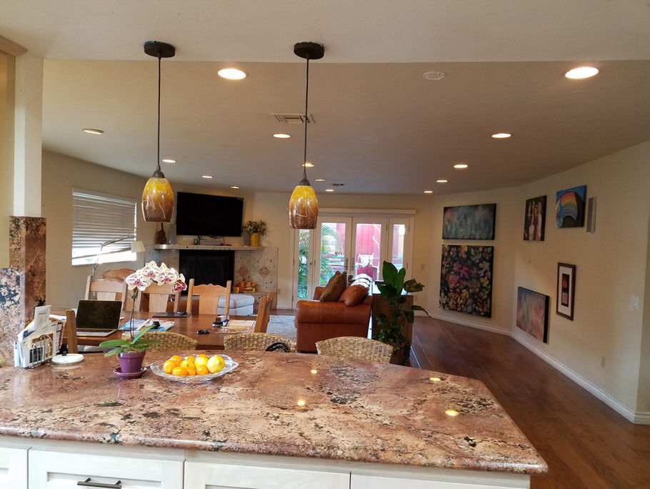 Kitchen and shared living space at a Rena's Rentals 63rd Street home